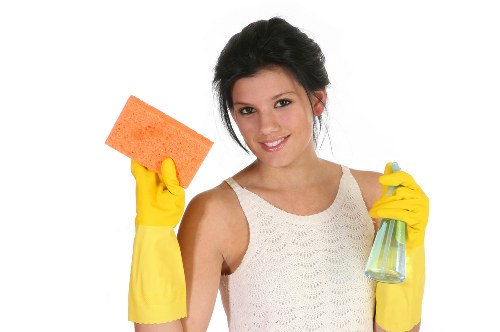 Professional using protective equipment while handling carpet cleaning products