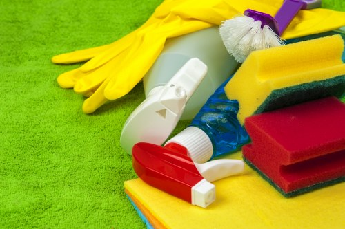 Staff member responding carefully to a workplace hazard during cleaning